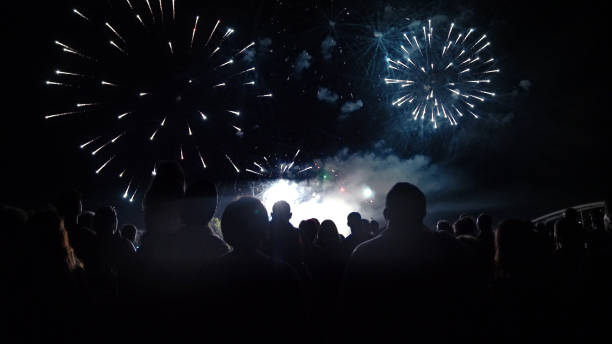 istock Crowd watching fireworks and celebrating new year eve 1192046139