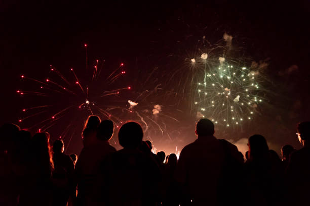 istock Crowd watching fireworks and celebrating new year 1192046413
