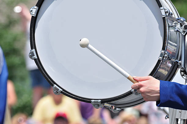 Drummer Playing Bass Drum in Parade  bass drum photos stock pictures, royalty-free photos & images