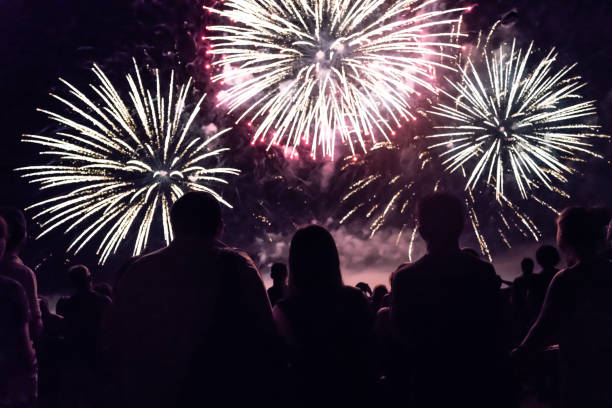 istock Crowd watching fireworks and celebrating new year eve 1192046787