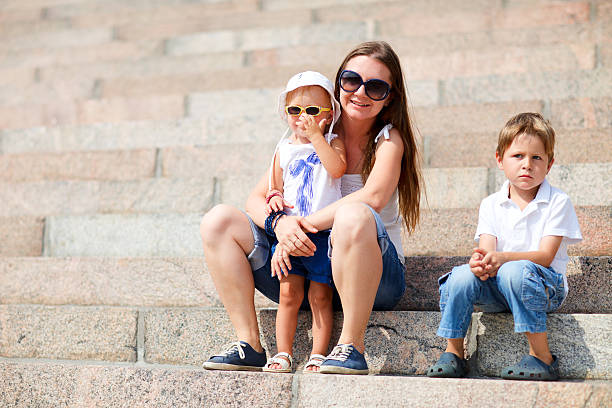 istock Family sitting on steps outdoors 119204779