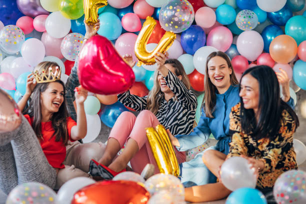 istock Group of ladies having fun with balloons 1192049872