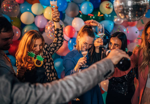 istock Friends drinking champagne at the party 1192050620