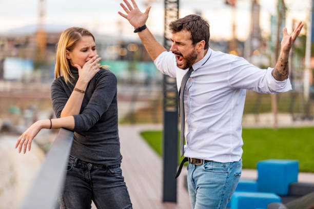 istock Handsome Man is Arguing with his Girlfriend Near the River 1192051023
