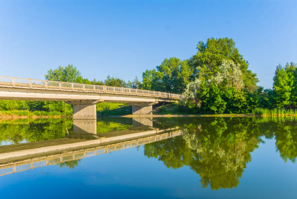 istock bridge over a quirt summer river 1192051167