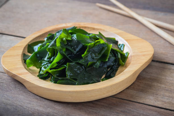 istock Wakame seaweed on wooden plate 1192051819