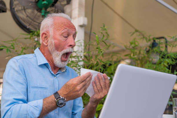 istock Senior Man with Allergic Problems in City Cafe 1192052311