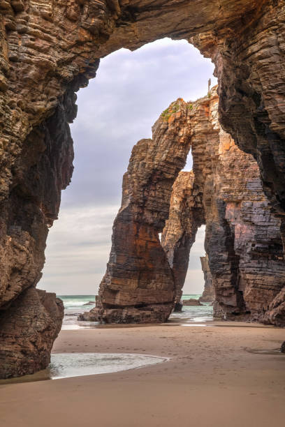 istock Natural stone archs on Playa de Las Catedrales, Spain 1192052851