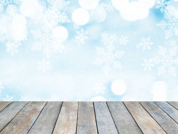 istock Wooden table top over abstract Christmas blue background 1192053523