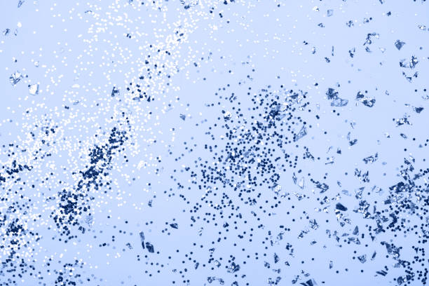 istock Classic blue confetti and stars and sparkles on blue background. 1192054343