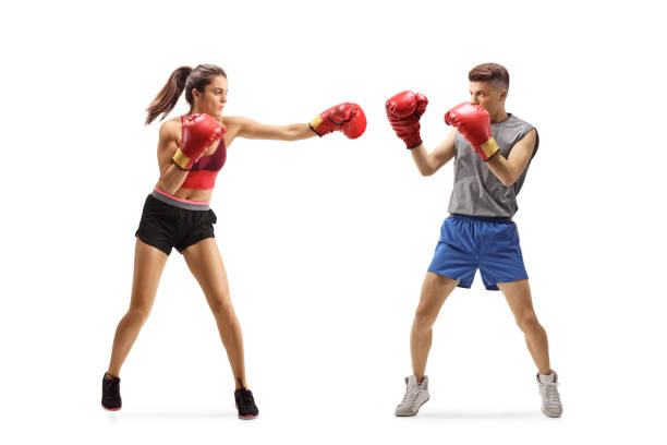 istock Young female and male practicing box 1192055511