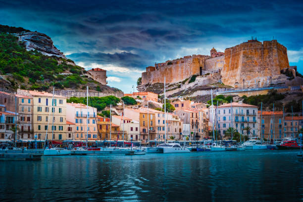 Image of Bonifacio port and Citadel in South of Corsica. Image of Bonifacio port and Citadel in South of Corsica. Harbour and Limestone cliffs with Fortress on the very top. Breathtaking views of the French island. bonifacio stock pictures, royalty-free photos & images