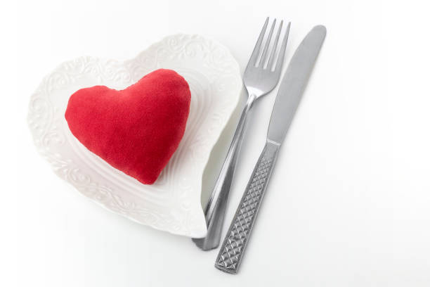 istock Red soft woolen heart on a white plate heart shape 1192060062