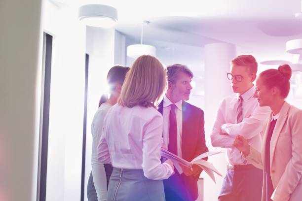 istock Business people discussing plans over document in office 1192060288