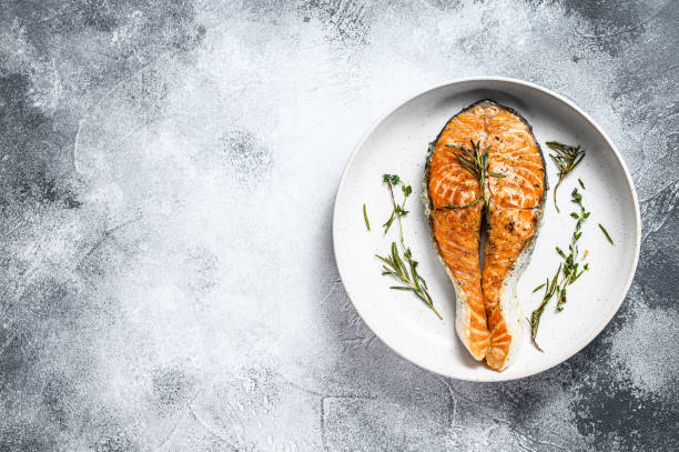 istock Grilled salmon steak. Atlantic fish. Gray background. Top view. Space for text 1192060430
