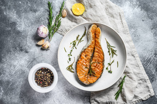 istock Grilled salmon steak. Atlantic fish. Gray background. Top view 1192060453