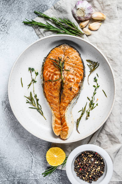 istock Grilled salmon steak. Atlantic fish. Gray background. Top view 1192060474