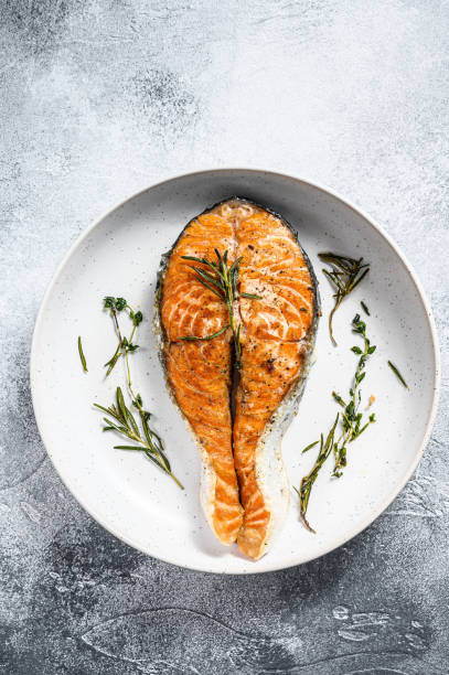 istock Grilled salmon steak. Atlantic fish. Gray background. Top view 1192060495