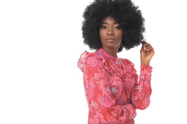 istock Beuatiful afro-american model in pink mini dress making funny faces. 1192062831