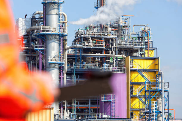 istock Petrochemical inspector with drawing 1192062930
