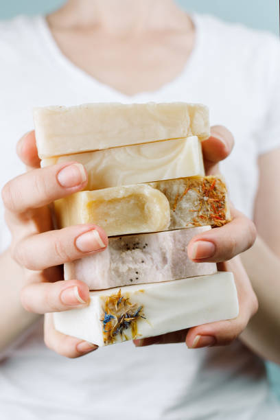 istock Closeup of woman's hands holding a stack of natural handmade soap 1192063268