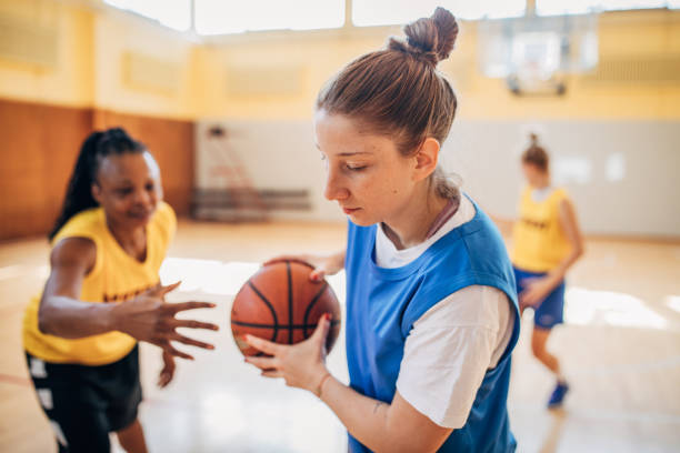 istock Young women playing basketball 1192064695