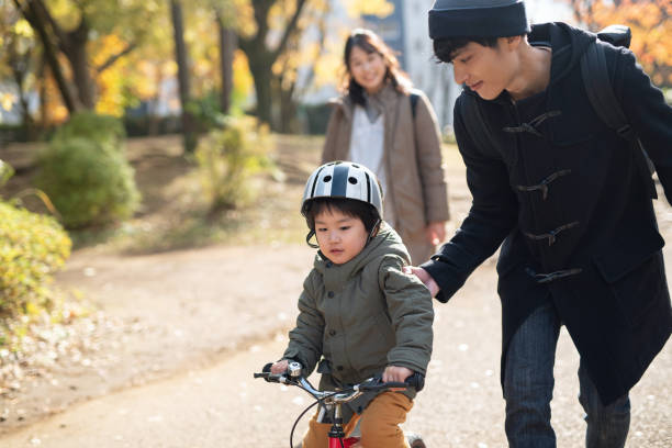 istock Father teaching his son how to ride bicycle 1192066185