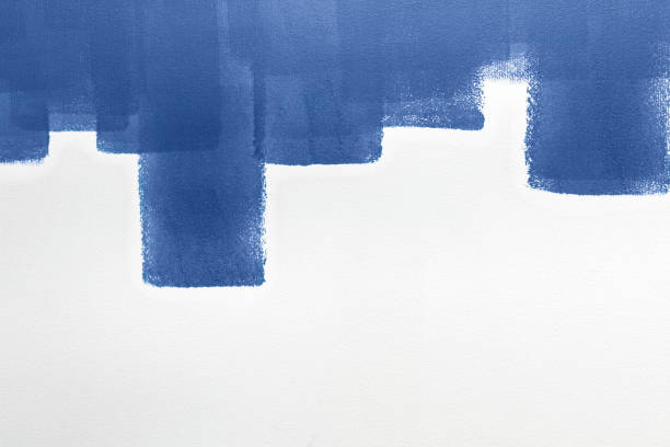 Strips of blue paint on a white wall. Home renovation, texture, color of 2020 year. Space for text.