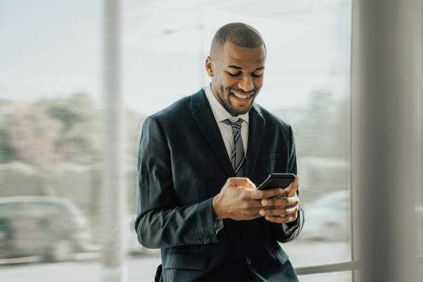 istock Businessman using cellphone on the tram 1192068380