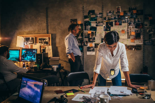 istock Woman detective working on a case with colleagues 1192068630