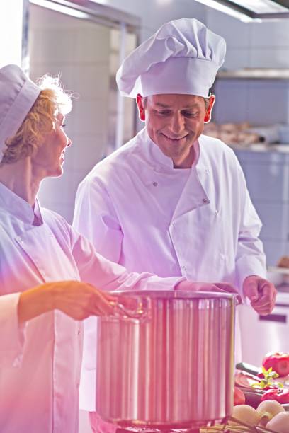 istock Mature chefs cooking together in kitchen restaurant 1192071195