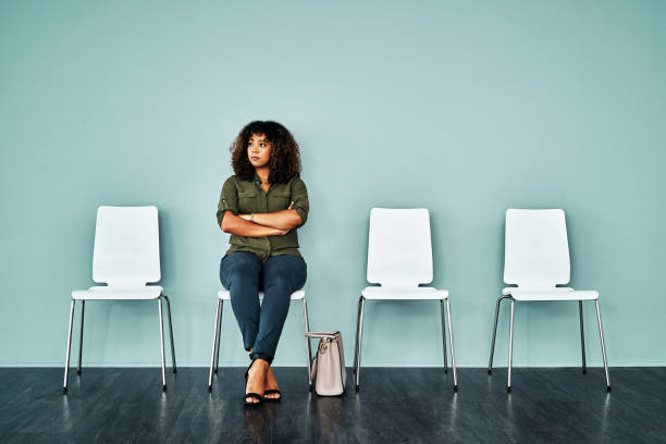 pre interview nervousness can be quite normal - sitting on a chair imagens e fotografias de stock