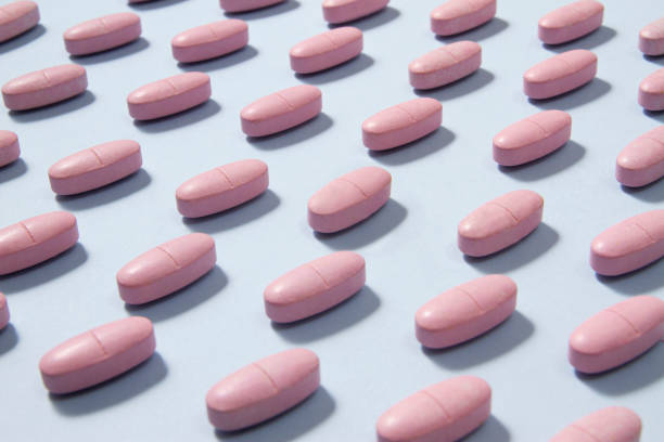 istock Beauty Pills on Blue Background 1192071784