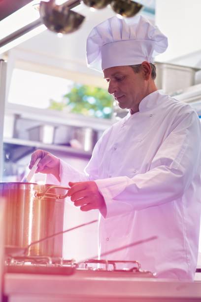 istock Mature chef cooking in restaurant kitchen 1192072572