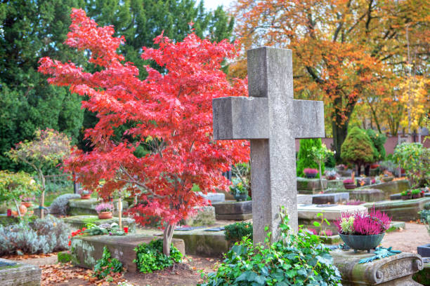 stone cross and colorful autumn