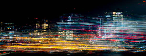 The Thames at night looking West from Westminster Bridge. A long exposure with skyscrapers in the background and reflections on the Thames. It has in camera horizontal motion light trails creating a surreal abstract effect.