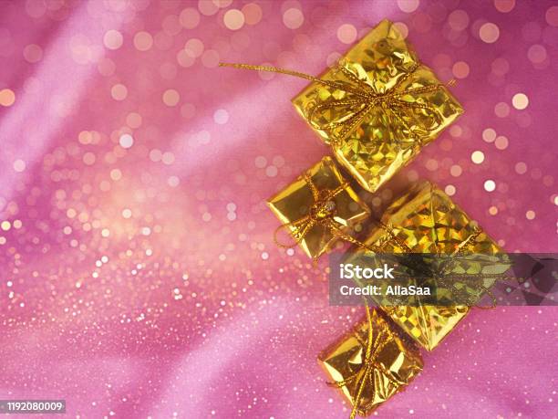 Christmas Tree On A Background Of Shiny Pink Satin As Background Silk Background Christmas Card Happy New Year Greetings Gifts Christmas Symbols On Pink Silk Stock Photo - Download Image Now