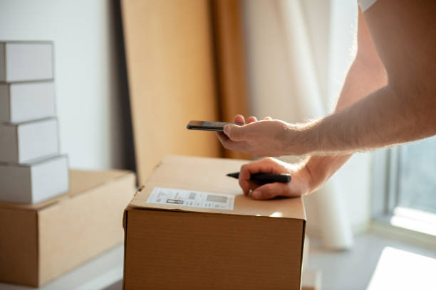 istock Delivery service, scanning a shipping label 1192080073