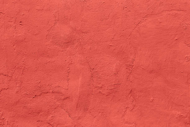 istock flat live coral color plaster wall matte texture 1192080427