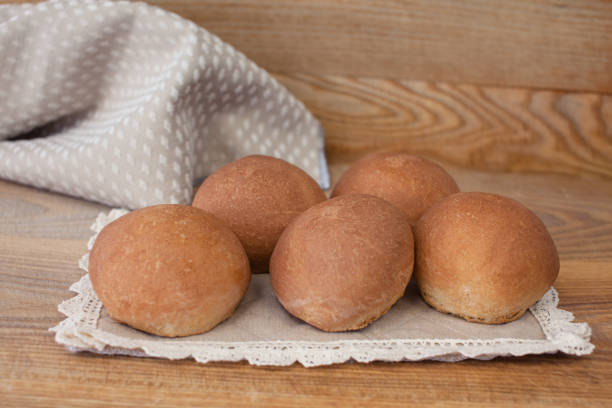 istock Fresh mouth-watering buns. Several delicious round buns 1192080467