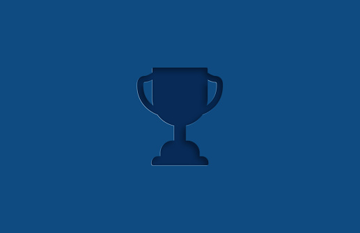 Embossed Trophy Award icon on blue background. Designed with the color of the year. Horizontal composition with copy space.