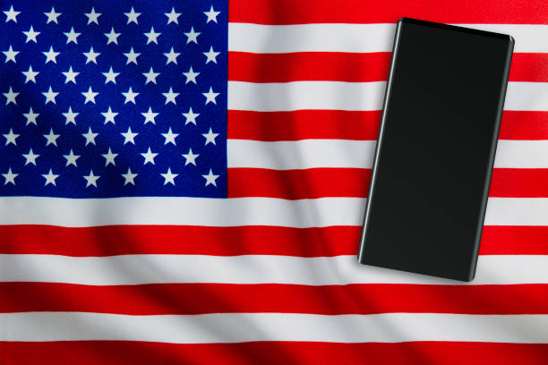 istock Modern Mobile Phone on Full Frame USA Flag 1192081758