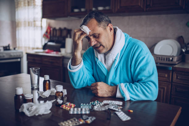 istock A senior man is sick with a cold 1192082604