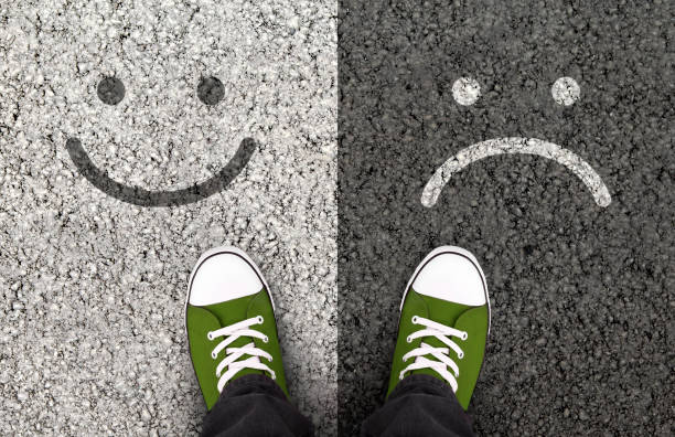 Smiles drawn on asphalt road, pros and cons Pros And Cons, Arguments For Or Against A Particular Issue. Smiles drawn on asphalt road pros and cons stock pictures, royalty-free photos & images