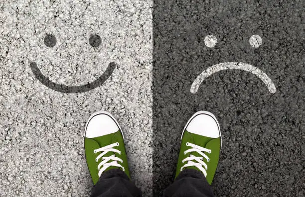 Pros And Cons, Arguments For Or Against A Particular Issue. Smiles drawn on asphalt road