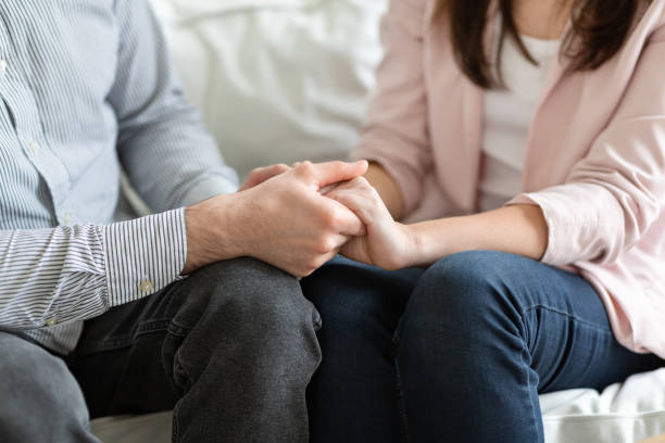 istock Married couple holding each other hands during family therapy 1192083421