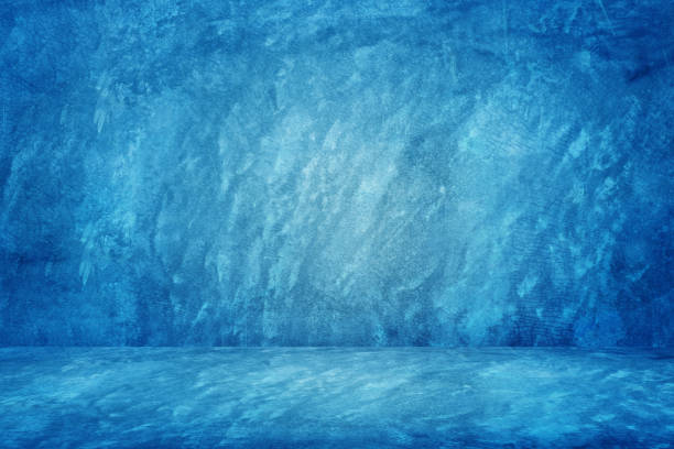 istock blue grunge texture cement or concrete wall banner, blank  studio background 1192084282