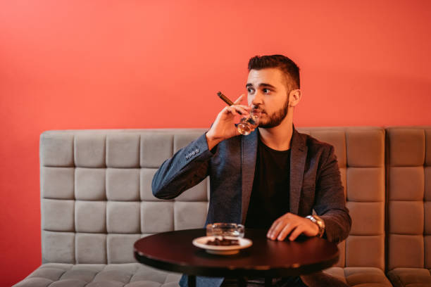 istock Handsome bearded man with a glass of whiskey 1192087286