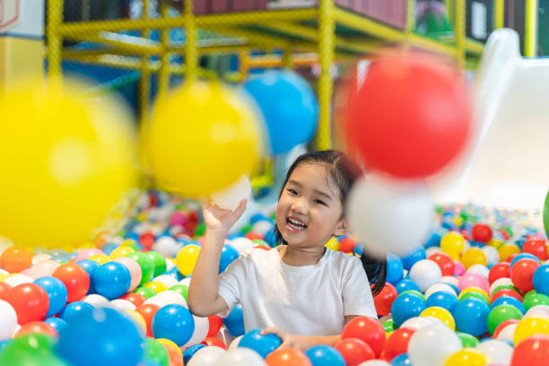 istock Cute girl at the Ball Pool 1192088538