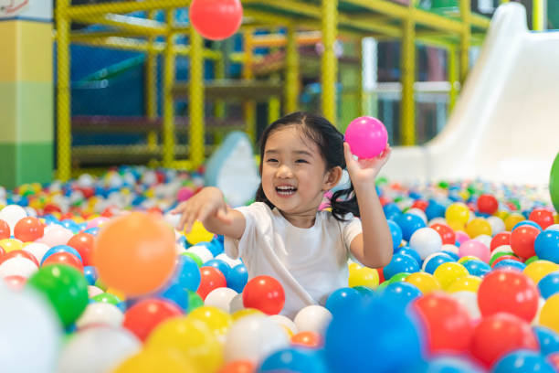 istock Cute girl at the Ball Pool 1192089018